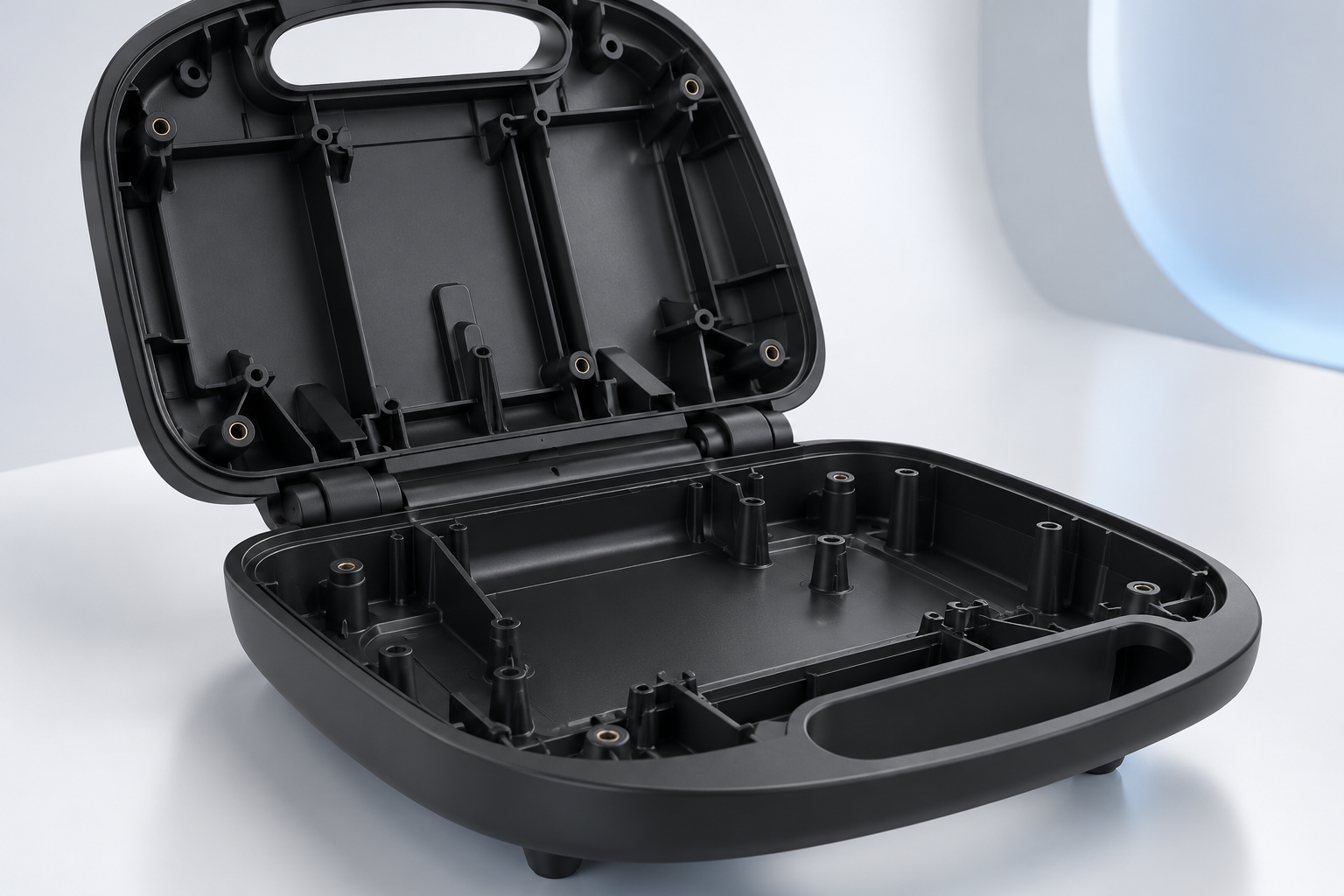 Interior of a moulded housing showing bosses and ribs